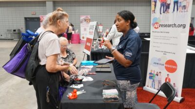 Monica Smith, representing the UAMS Translational Research Institute, helped expo attendees join the ARresearch registry of potential research volunteers.