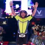 UAMS College of Medicine Student Brandon Hogge celebrates after crossing the finish line at the Ironman World Championship in Nice, France.