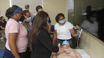 Physicians conduct a training session on point-of-care ultrasound technology. The training program is funded through the Health Resources and Services Administration’s Medical Student Education program.