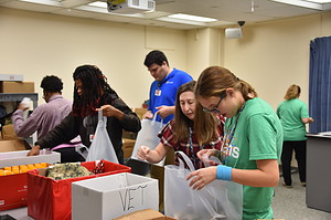 Interns from UAMS Project SEARCH assemble care packages for delivery to three facilities that assist veterans in central Arkansas. 