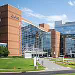 Photo of exterior of UAMS with Get With The Guidelines logo