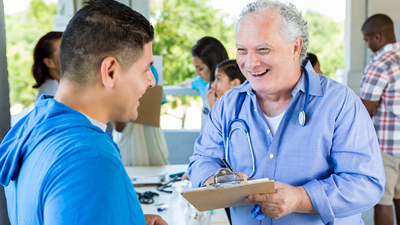 a doctor and patient interacting at a health fair