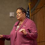 Sharon Ingram, assistant vice president at U.S. Bank and chair of the Arkansas Martin Luther King Jr. Commission, stands at the lectern as she gives a speech that focused on King’s six principles of nonviolence.