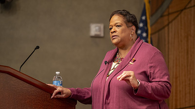 Sharon Ingram, assistant vice president at U.S. Bank and chair of the Arkansas Martin Luther King Jr. Commission, stands at the lectern as she gives a speech that focused on King’s six principles of nonviolence.