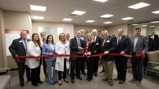 Cam Patterson, chancellor of UAMS and CEO of UAMS Health, and Danna Taylor, president of South Arkansas Regional Hospital, cut the ribbon at the new UAMS Health Family Medical Center in El Dorado.