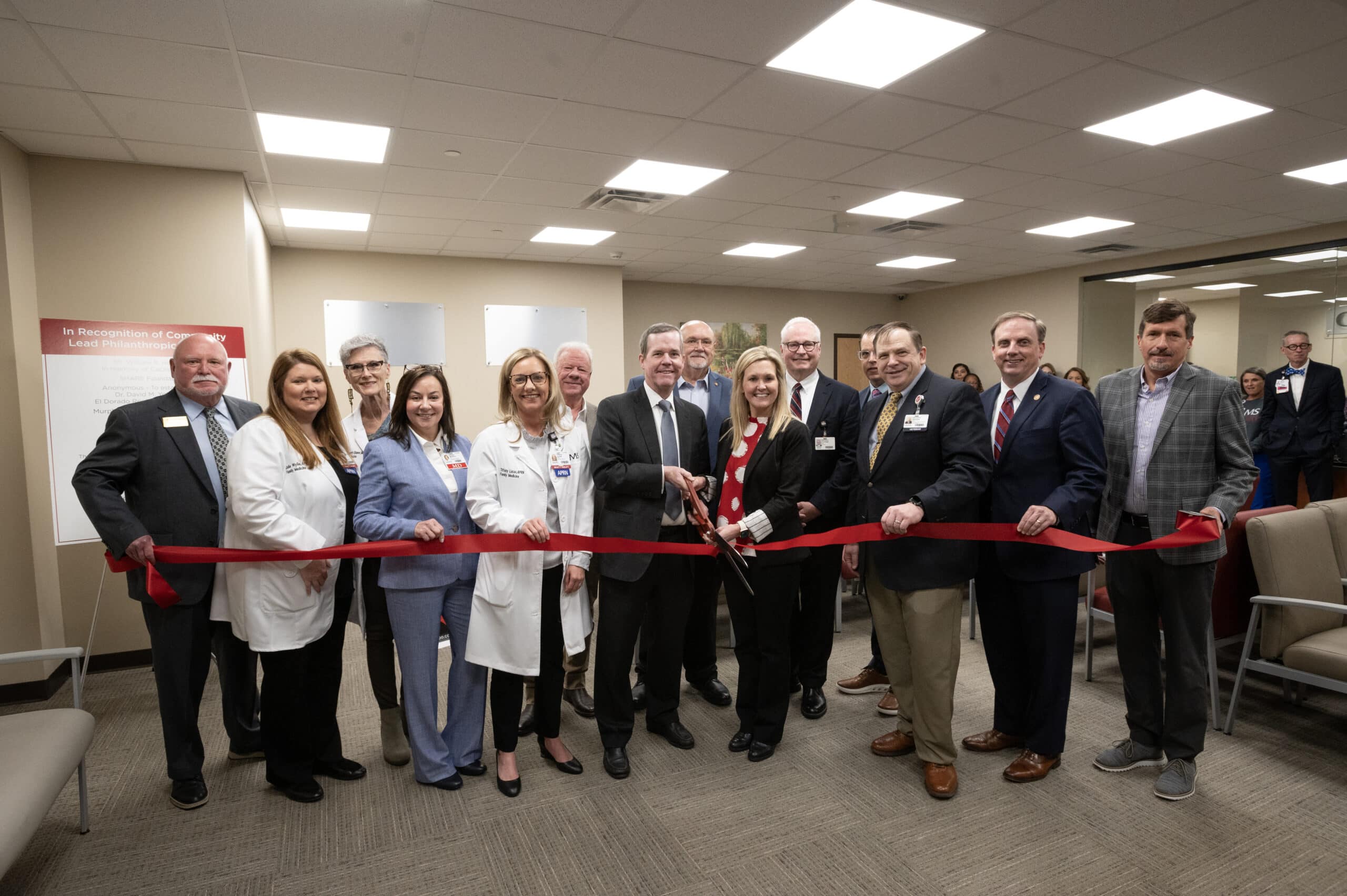 Cam Patterson, chancellor of UAMS and CEO of UAMS Health, and Danna Taylor, president of South Arkansas Regional Hospital, cut the ribbon at the new UAMS Health Family Medical Center in El Dorado.