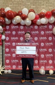 Eric Porter, described by class president Basri as "beloved by everybody on both campuses," celebrates his Med-Peds residency at UAMS.