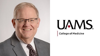 portrait of James Graham, M.D. in suit and tie with UAMS logo