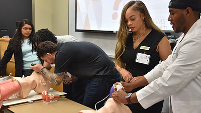 Students from the College of Nursing and College of Medicine take part in an intubation demonstration during the MAPS Conference.