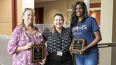 CJ Carrell, left, Jessica Stahulak, MHA, and Tammy Brooks stop for a photo after the Staff Excellence Awards. Stahulak is associate dean of administration in the College of Health Professions.