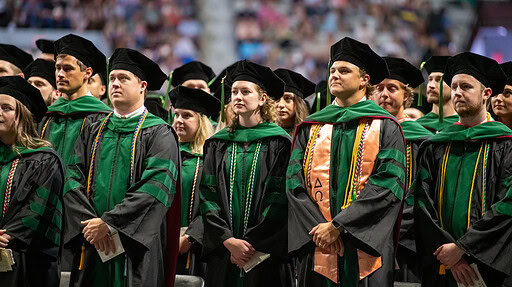 UAMS students take part in the May 18 commencement ceremony at Barton Coliseum in Little Rock.