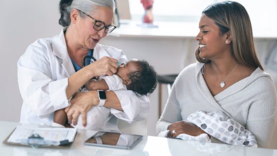 A doctor and new mom with baby