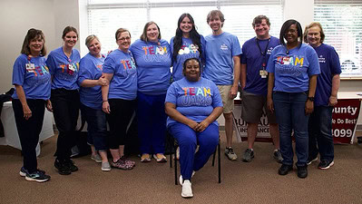 UAMS employees wearing matching blue t-shirts