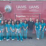 A group of high school students who attended one of UAMS' summer MASH camps