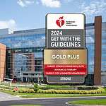 2024 Get With the Guidelines logo in front of UAMS stock photo