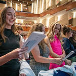 Students stand and read the medical student oath. Upper balconies in background.