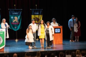 Even crutches couldn't keep proud family members, including those already wearing longer white coats, from walking across the stage to celebrate.