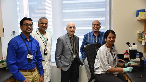 Researchers Meenakshisundaram Balasubramaniam (from left), Ph.D.; Srikanth Vallurupalli, M.D.; Robert J. Shmookler Reis, Ph.D.; Srinivas Ayyadevara, Ph.D.; and Akshatha Ganne are shown in their research laboratory at the UAMS Donald W. Reynolds Institute on Aging. Ganne was the lead author of the study published in the journal Aging Biology.