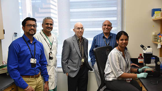 Researchers Meenakshisundaram Balasubramaniam (from left), Ph.D.; Srikanth Vallurupalli, M.D.; Robert J. Shmookler Reis, Ph.D.; Srinivas Ayyadevara, Ph.D.; and Akshatha Ganne are shown in their research laboratory at the UAMS Donald W. Reynolds Institute on Aging. Ganne was the lead author of the study published in the journal Aging Biology.