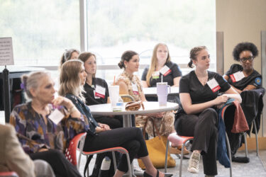 College of Nursing students listen to a speaker during the reception. 