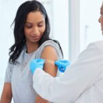 Young female patient getting a vaccine