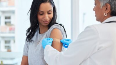 Young female patient getting a vaccine