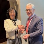 Shuk-Mei Ho, Ph.D., (left) receives the Dean’s Distinguished Faculty Scholar Award from Steven Webber, M.D., executive vice chancellor of the University of Arkansas for Medical Sciences (UAMS) and dean of the UAMS College of Medicine.