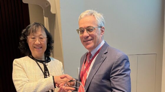 Shuk-Mei Ho, Ph.D., (left) receives the Dean’s Distinguished Faculty Scholar Award from Steven Webber, M.D., executive vice chancellor of the University of Arkansas for Medical Sciences (UAMS) and dean of the UAMS College of Medicine.