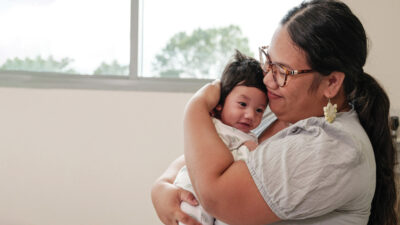 A Marshallese woman holds her baby