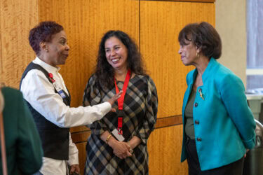 Beverly Malone speaks with attendees after her lecture at UAMS.