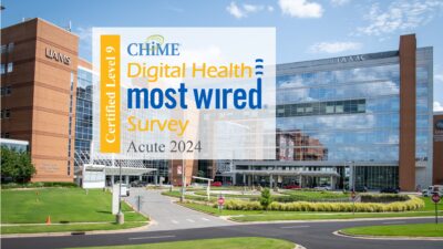 A logo for the CHIME Digital Health Most Wired honor is shown over a photo of the UAMS Medical Center in Little Rock.