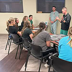 Medical professionals talk with high school students