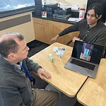 Sonara Health Business Operations Manager Kshitij Verma (right) demonstrates how to use the online repository to Jere Brewer of UAMS’ Center for Addiction Services and Treatment.