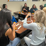 High school students practice injections using oranges