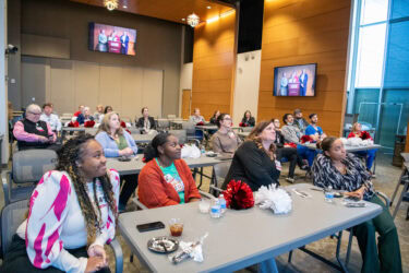 UAMS employees view the announcement during a watch party in the Hospital Lobby Gallery.