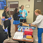 Medical professionals talk with high school students