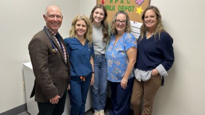 Celebrating the opening of the Russellville Pediatric and Adolescent Clinic's milk depot are (from left to right) Neylon Pilkington, M.D., pediatrician; Molly Pilkington, RN, clinic manager; Jayli Holt, MPH, student at UAMS Fay W. Boozman College of Public Health; Misty Virmani, M.D., FAAP, executive medical director of the UAMS Milk Bank; and Robin Kirby, M.D., pediatrician.