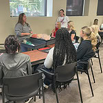 Medical professionals talk with high school students