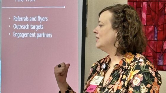 Sarah Moore, associate director of the UAMS Institute for Community Health Innovation, speaks to a group about prenatal care.