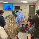 Medical professionals talk with high school students