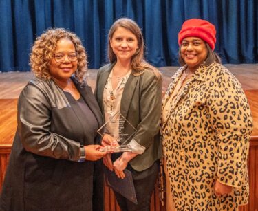 Kelsey Bounds (center), who nominated the Olly Neal Community Health Center for Research Partner of the Year, poses with the center's representatives, Cassandra Franklin (left) and LaFay Broadway.