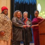 The Olly Neal Community Health Center, represented by (l-r) LaFay Broadway and Cassandra Franklin, received the Research Partner of the Year Award. Laura James, M.D., TRI director, and Tiffany Haynes, Ph.D., director of TRI’s Community Engagement Core, presented the award.