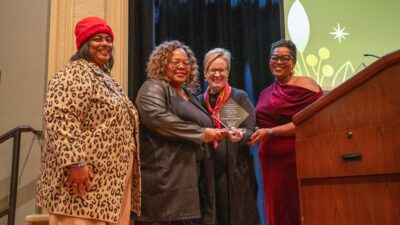 The Olly Neal Community Health Center, represented by (l-r) LaFay Broadway and Cassandra Franklin, received the Research Partner of the Year Award. Laura James, M.D., TRI director, and Tiffany Haynes, Ph.D., director of TRI’s Community Engagement Core, presented the award.