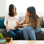 Doula speaking to a pregnant woman