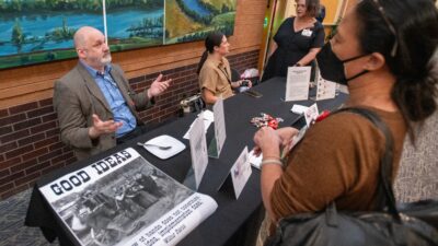 Geoffrey Curran, Ph.D., discusses implementation science opportunities with attendees of the 2024 Translational Research Institute Research Expo.