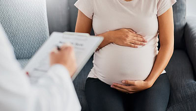 Pregnant woman in for a routine checkup with her doc