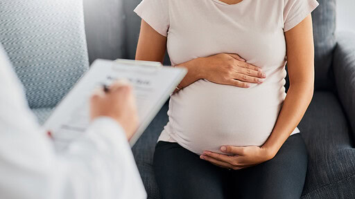 Pregnant woman in for a routine checkup with her doc