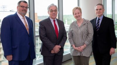 (L-R) Mathias Brochhausen, Ph.D., Steven A. Webber, MBChB, MRCP, Laura James, M.D., and Fred Prior, Ph.D., gathered for a photo prior to the symposium.