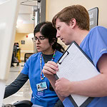 UAMS residents looking at a computer screen