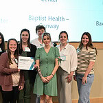 Representatives from Baxter Health accept their platinum banner for their accomplishments during the ARPQC’s recently completed “Safe Reduction of Primary Cesarean Birth” initiative.